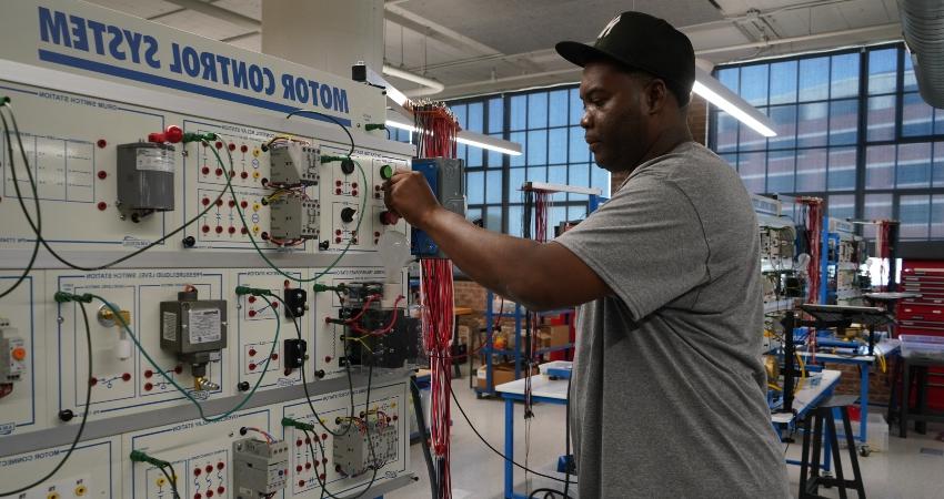 African American male working with a motor control system